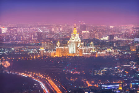 Вид на город со смотровой площадки Панорама 360 на высотки в свете ночных фонарей и комплекс Лужники, башня Федерация Москва-Сити, Москва