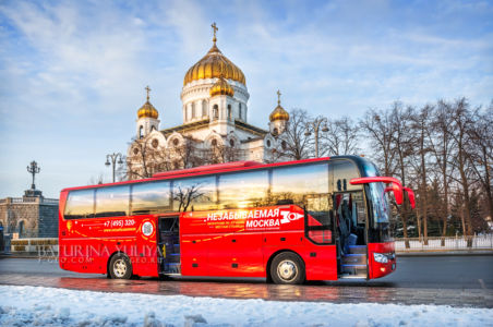 Red bus "Unforgettable Moscow" on the Prechistenskaya embankment